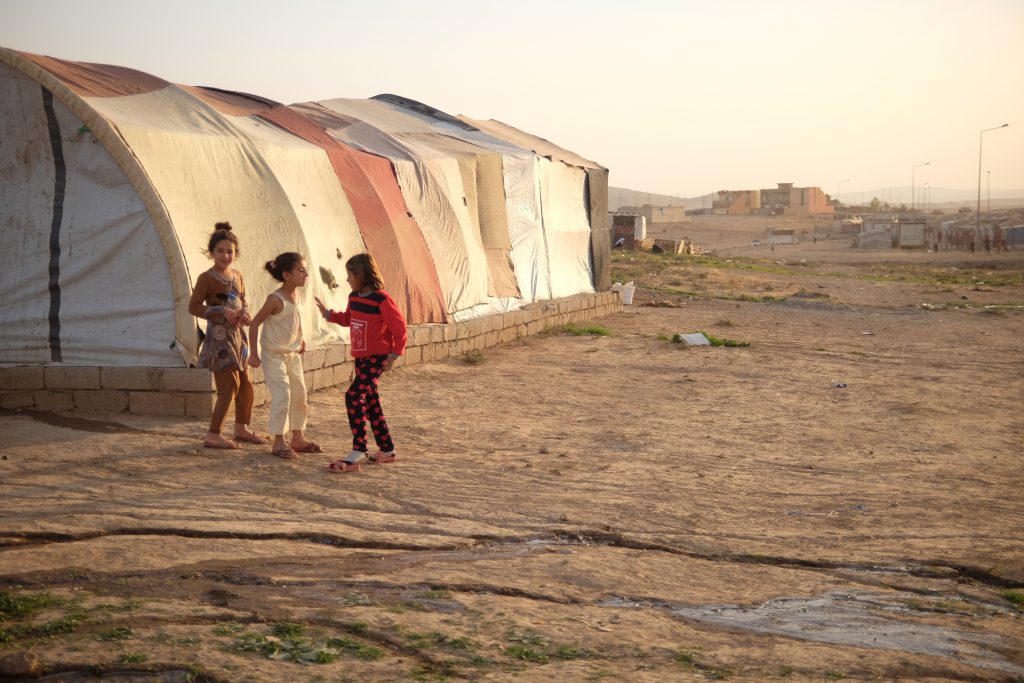 Yazidi children play at a refugee camp in Iraqi Kurdistan. We have visited camps on our Iraq tours