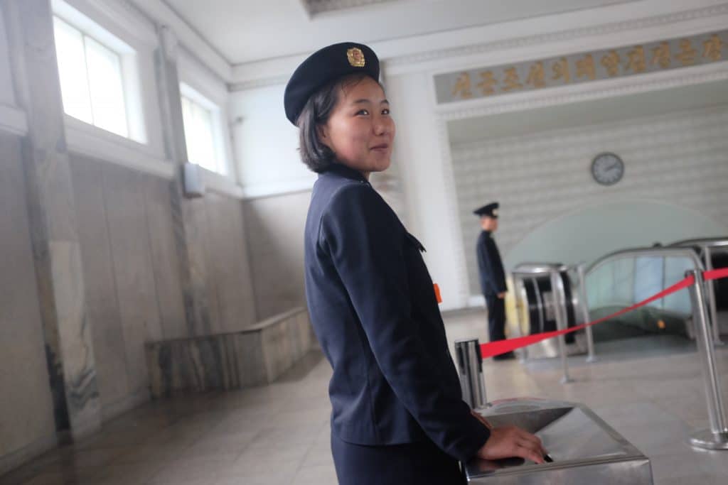ticket collector on the Pyongyang metro, North Korea